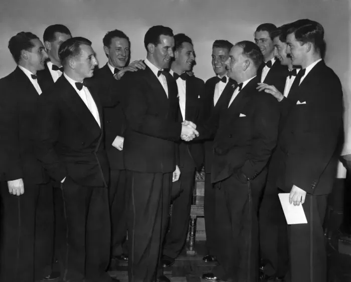 Framed Print : Lancashire cricketers look on as Ken Grieves (left) congratulates team captain Cyril Framed Print : Lancashire cricketers look on as Ken Grieves (left) congratulates team captain Cyril