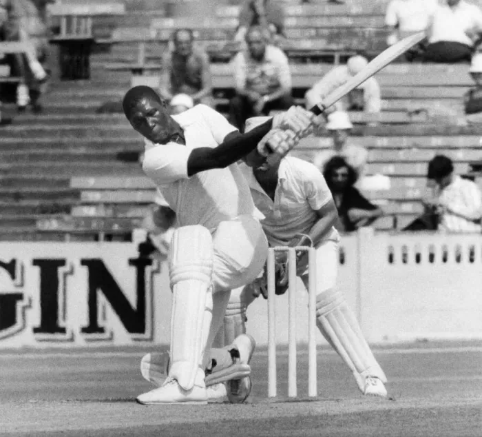 Framed Print : Lancaster. vs. Somerset. Joel Garner hits the ball out of the ground at Old Trafford with Framed Print : Lancaster. vs. Somerset. Joel Garner hits the ball out of the ground at Old Trafford with