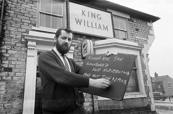 Landlord of the King William pub in Shildon, County Durham, puts a blackboard up. 1972