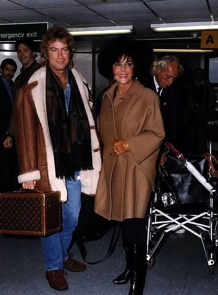 Larry Fortensky with wife Elizabeth Taylor arriving at London Heathrow from Geneva