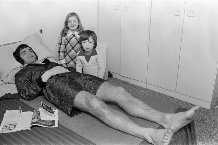 Framed Print : Larry Lloyd Coventry City football player lying on bed at home as he recuperates