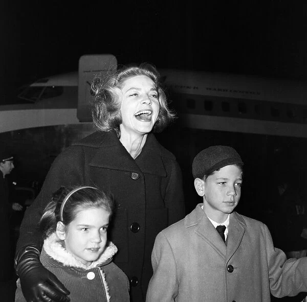 Lauren Bacall at London Airport with her two children, Stephen (aged 10