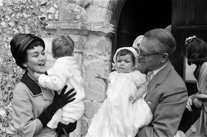Framed Print : Laurence Olivier and Joan Plowright attend the Christening of their daughter Tamsin