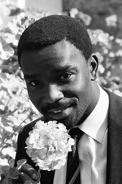 Laurie Cunningham poses for the camera with a flower Madrid Spain