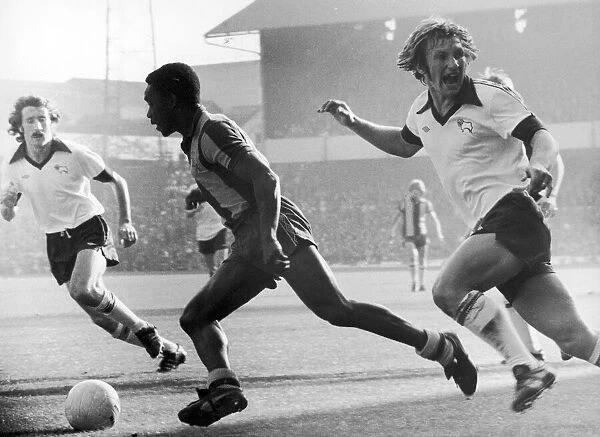 Laurie Cunningham of West Bromwich Albion, in action v Derby County, Colin Todd (right)