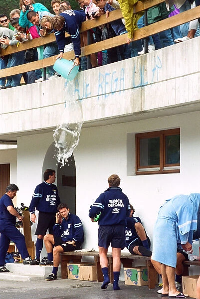 Lazio footballer Paul Gascoigne has a bucket of water tipped over him by teammate Beppe
