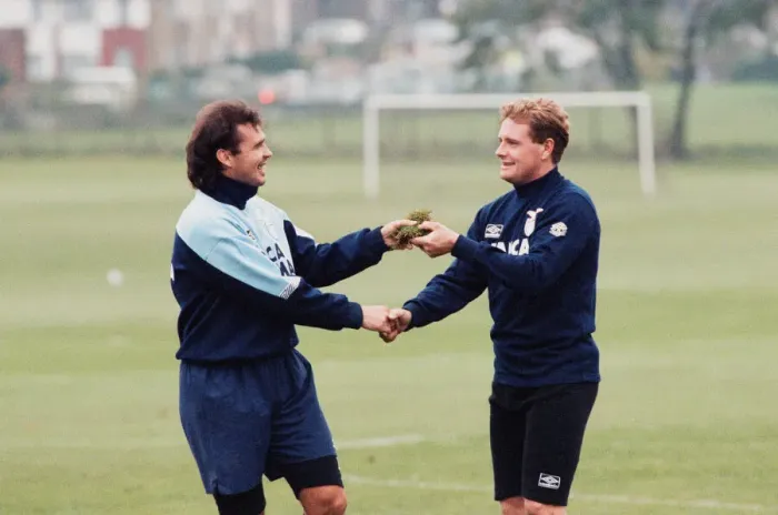 Framed Print : Lazio footballer Paul Gascoigne is handed a piece of turf by teammate Roberto Cravero