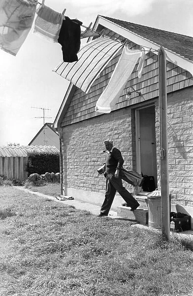 Leader of the Labour Party Harold Wilson sets out for a game of golf from his cottage at