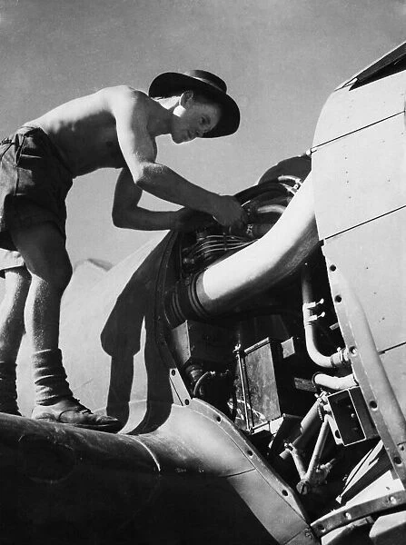 Leading aircraft man R. J. Fennell of Margate, Kent hard at work on the engine of an R. A