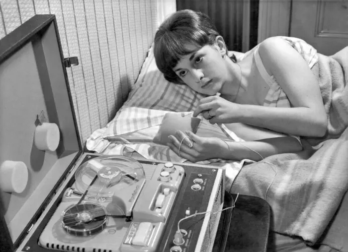 Framed Print : Learn while you sleep machine. While this young lady sleeps peacefully a tiny loudspeaker Framed Print : Learn while you sleep machine. While this young lady sleeps peacefully a tiny loudspeaker