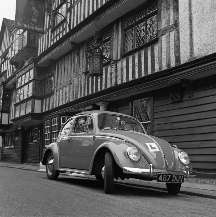 Framed Print : Learner driver in a Volkswagen Beetle. May 1962 Framed Print : Learner driver in a Volkswagen Beetle. May 1962