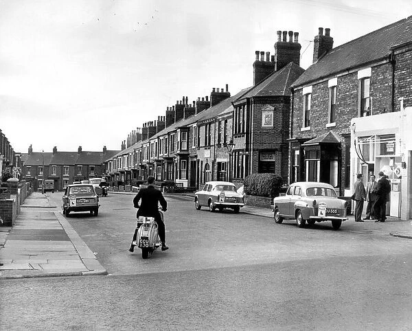 A learner tries to get his scooter started in Ada Street, South Shields, 1959