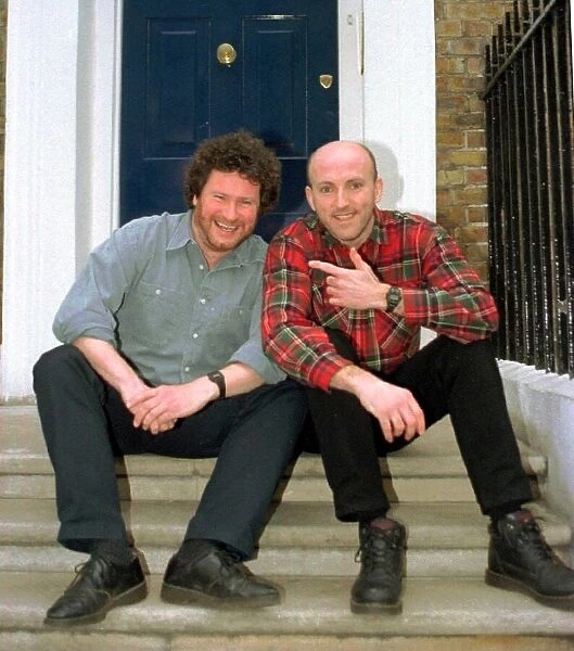 Lee Hurst and Rory McGrath fooling around in London. Two comedians comics from