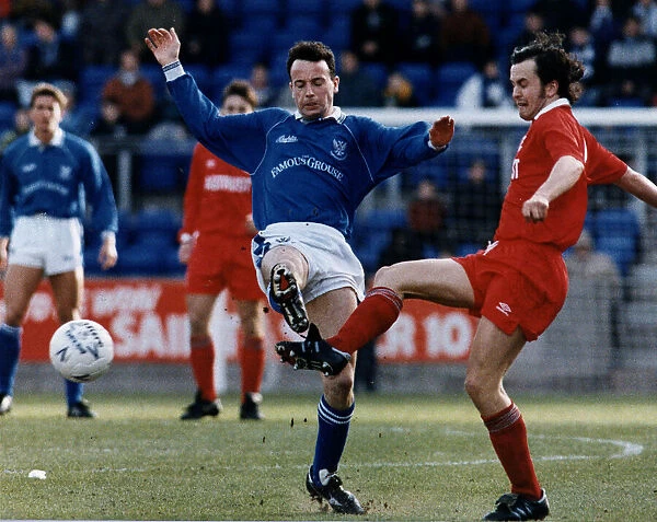 Lee Richardson Aberdeen football player(right) tackles Gary McGinnis of St Johnstone