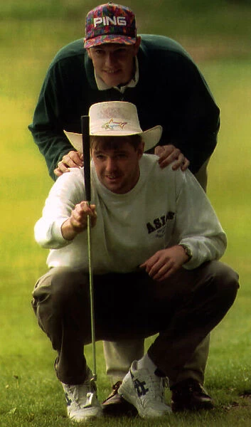 Lee Sharpe and Gary Pallister footballers playing golf