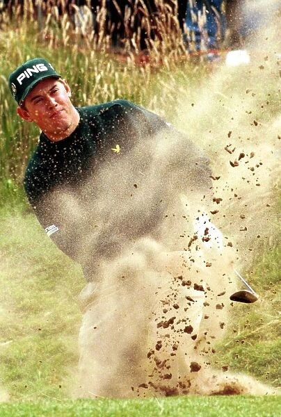Lee Westwood hits his way out of a bunker during the third round of the Open Golf