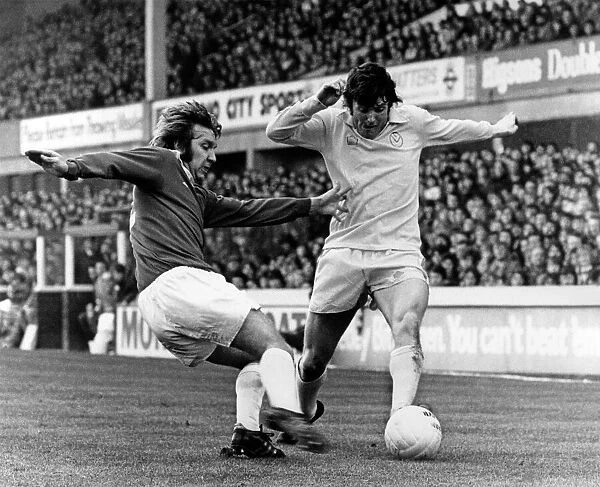 Leed footballer Eddie Gray tries to evade a tackle from Evertons Mike Bernard