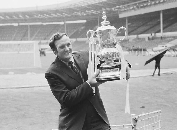 Leeds Manager Don Revie seen here in a deserted Wembley holding the F. A
