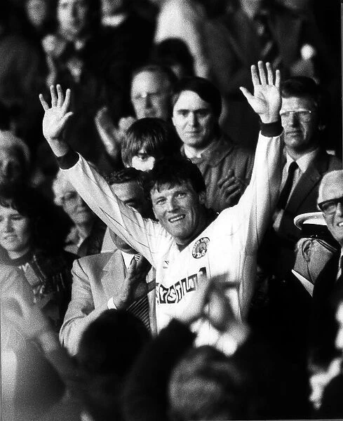 Leeds manager Eddie Gray waves to the fans from the stand after his last playing game for
