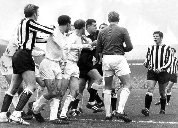 Leeds player Jack Charlton in the middle of this sskirmish in a game against Newcastle