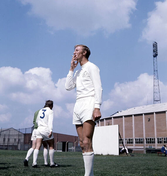 Leeds United footballer Jack Charlton smoking a cigarette during a training session