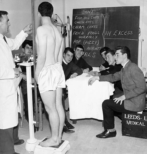 Leeds United Juniors. Trainer Les Cocker talking about diet to John Price