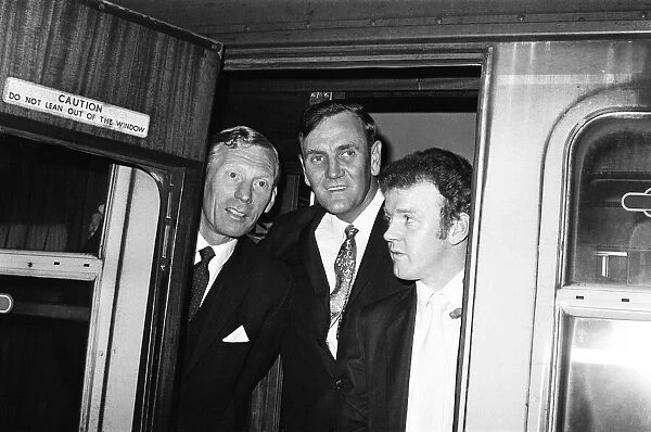 Leeds United manger Don Revie with Billy Bremner and Syd Owens at Leeds station before