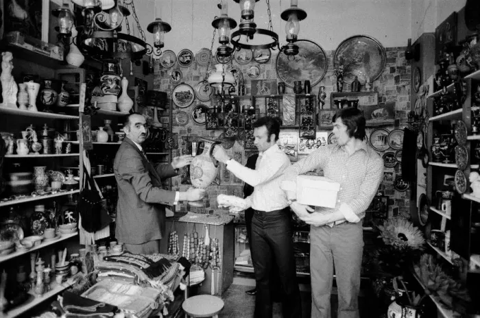 Framed Print : Leeds United players buying gifts in a local shop as they take a walk around the town of Framed Print : Leeds United players buying gifts in a local shop as they take a walk around the town of