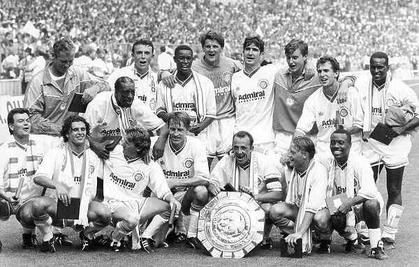 Leeds United players with The Charity Shield after beating Liverpool