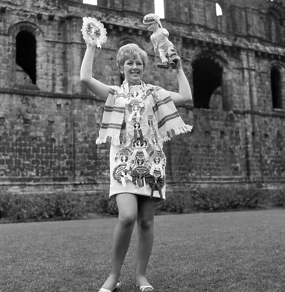 Leeds United secretary Janet Rossidale with rosettes of all the teams beaten that season