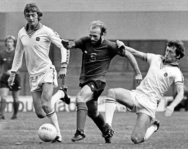 Leeds United v Derby County. Archie Gemmill, is brought down as he races through