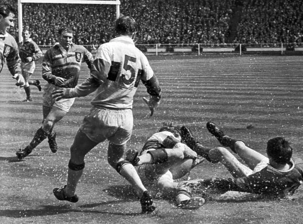Leeds v Wakefield Rugby League Cup Final 11th May 1968. Smith of Leeds on his back as