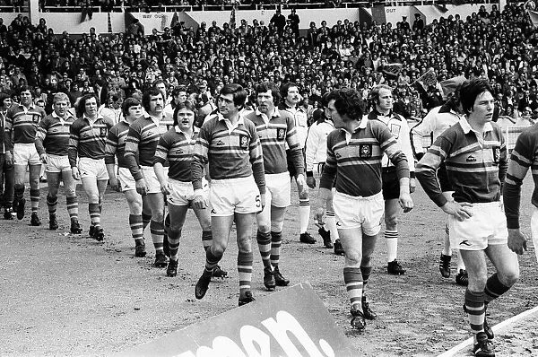 Leeds and Widnes players make their way on to the pitch at the start of the Rugby League