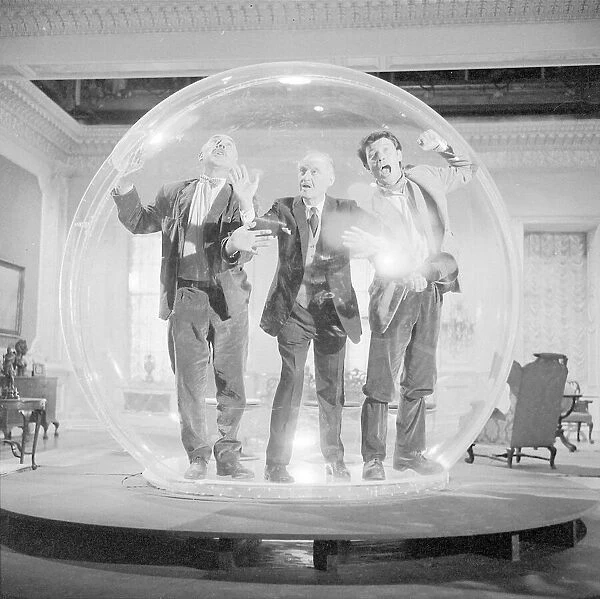 Left to right Lionel Jeffries, Eric Portman and Laurence Harvey seen here on the set of