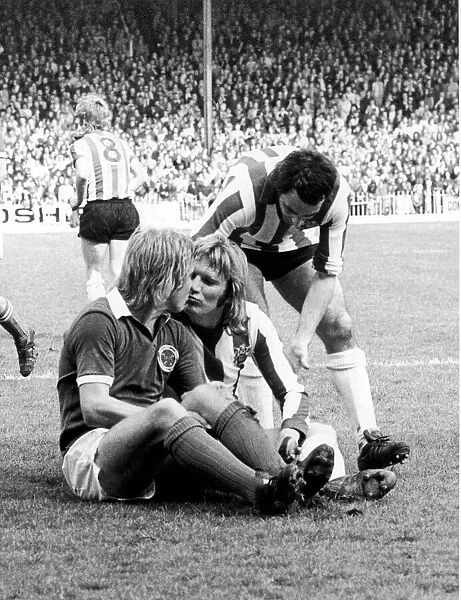 Leicester City footballer Alan Birchenall kisses and makes up with Tony Currie of