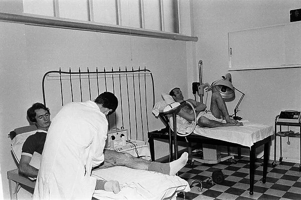 Leicester City team training. Len Glover and Peter Rodrigues in the treatment room