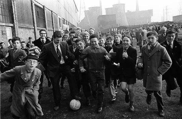 Leicester town folk play football before the 1961 FA Cup Final between Leicester City