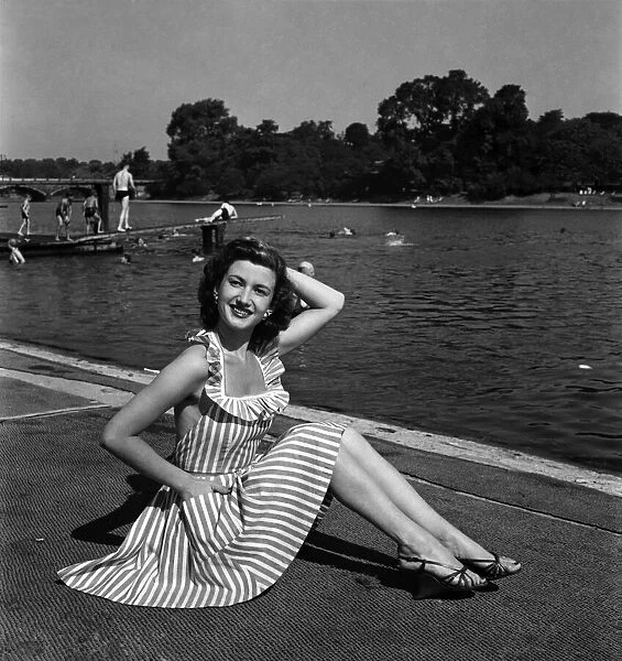 Lena Marshall wearing a stripy dress. August 1949 O20003-001