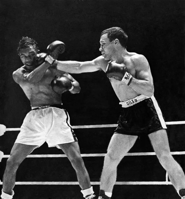 Framed Print : Lennie Matthews takes a hefty punch from Dave Charnley during their lightweight bout