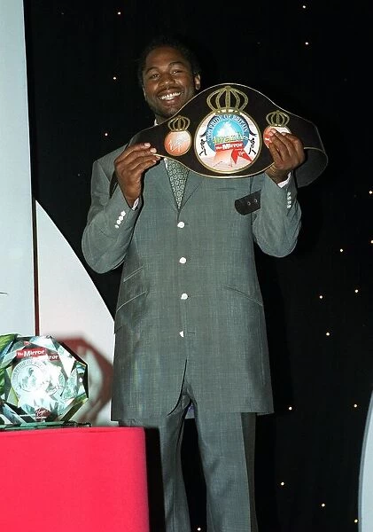 Lennox Lewis boxer with his Pride of Britian belt May 1999 at The Mirror Pride of