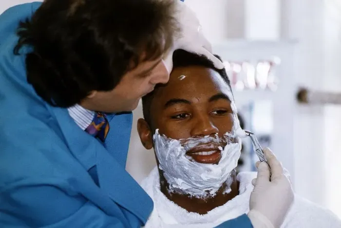Framed Print : Lennox Lewis Boxing Heavyweight Boxer sitting down being shaved 28th February 1993 Framed Print : Lennox Lewis Boxing Heavyweight Boxer sitting down being shaved 28th February 1993