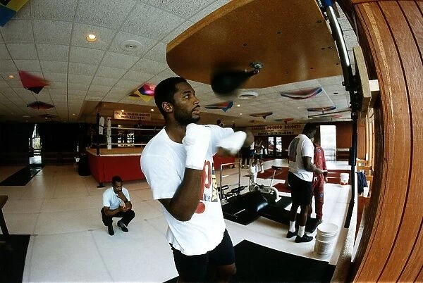 Lennox Lewis Boxing Heavyweight boxer training in the gym punching punch ball