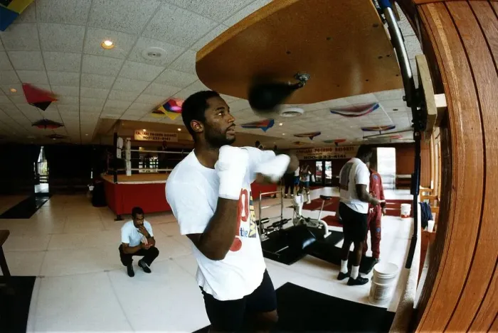 Framed Print : Lennox Lewis Boxing Heavyweight boxer training in the gym punching punch ball Framed Print : Lennox Lewis Boxing Heavyweight boxer training in the gym punching punch ball
