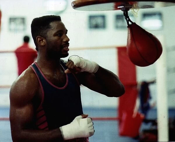 Lennox Lewis Boxing trains in the gym by hitting the speed ball