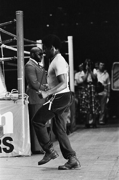 Leon Spinks training ahead of his second fight with Muhammad Ali under the watchful eye