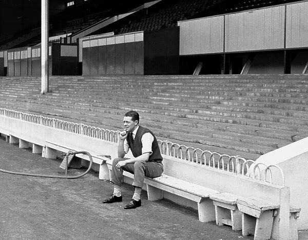 Les Allen of Tottenham Hostpur sitting alone in the ground at White Hart Lane May