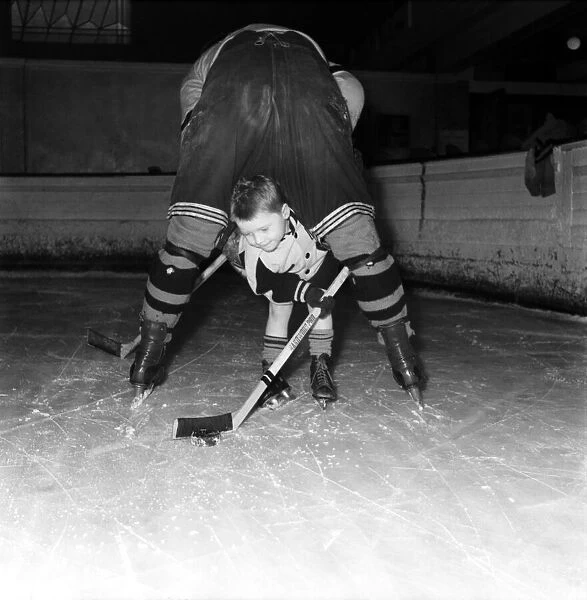Les Anning (Ice Hockey Player) Seen here playing with his son. March 1953 D1236