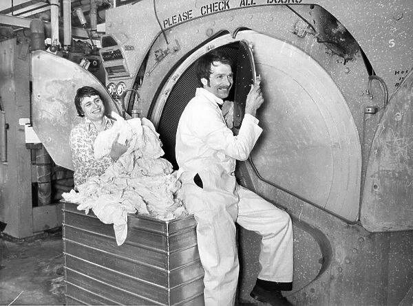 Les Callaghan and Colin Pitcher at a washing machine in the laundry at Newcastle General