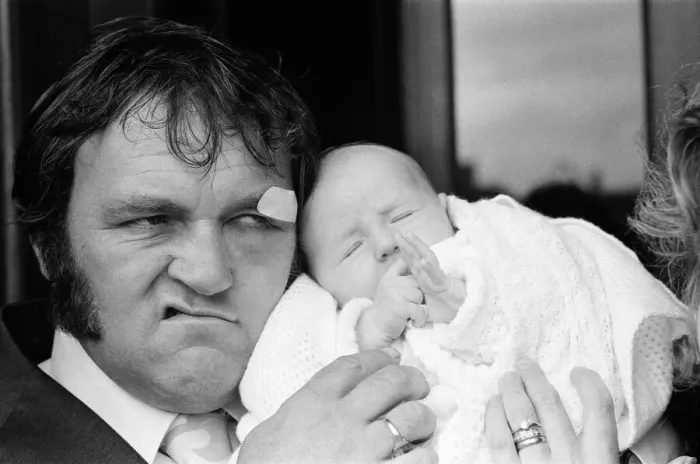 Framed Print : Les Dawson with his baby daughter Pamela Jane at her christening at Cleveleys, Lancashire Framed Print : Les Dawson with his baby daughter Pamela Jane at her christening at Cleveleys, Lancashire