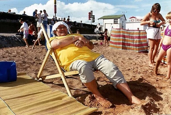 Les Dawson Comedian on Beach sitting in Deck Chair
